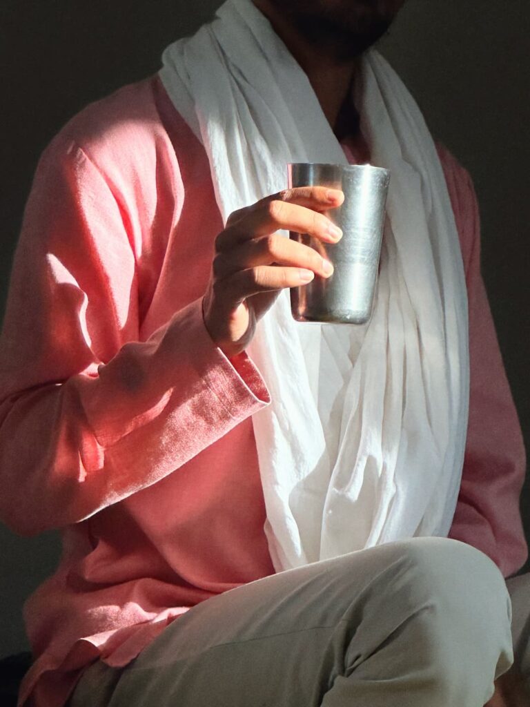 Holding Ayurvedic detox drink