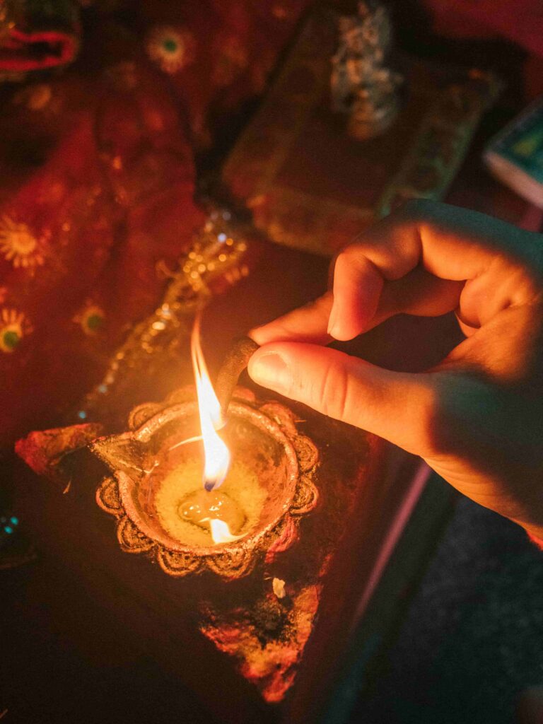 Lighting up incense from Burning sacred fire in conscious community