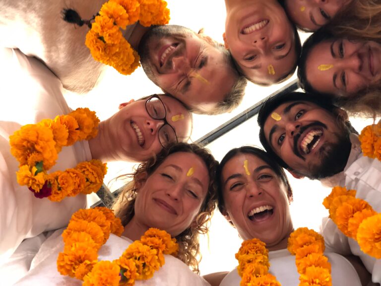 A yoga community group celebrating at the retreat.