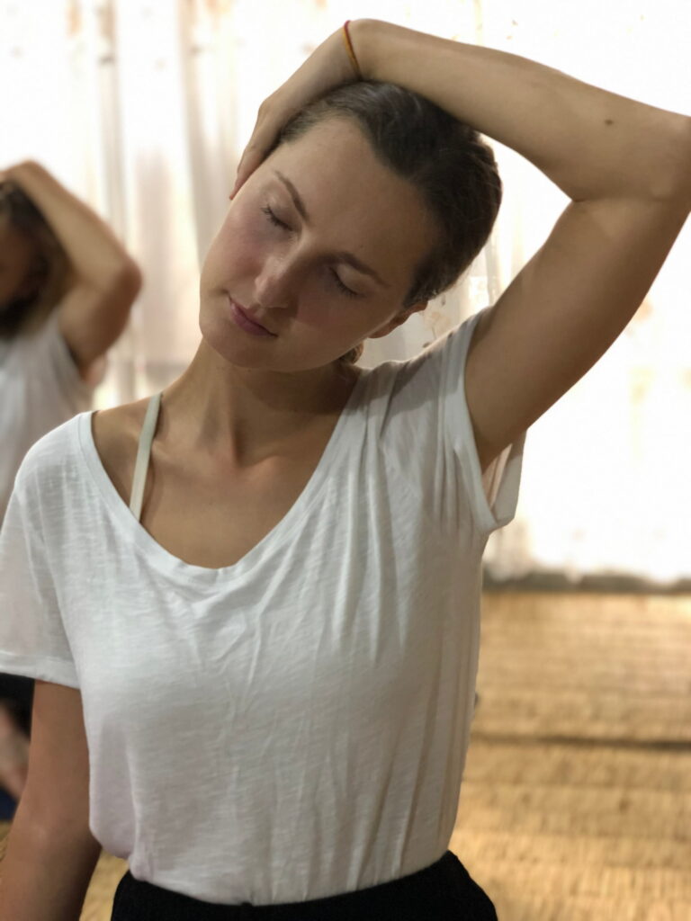 Students practicing during Yoga therapy teacher training course in Rishikesh India