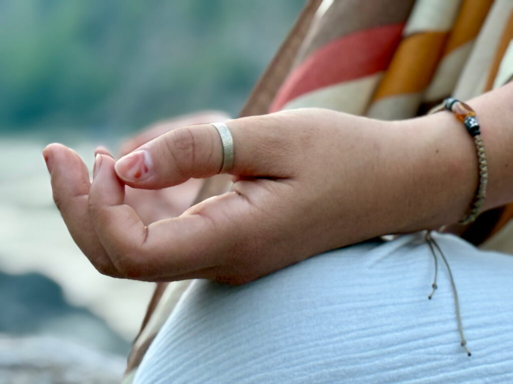 a student hands during meditation