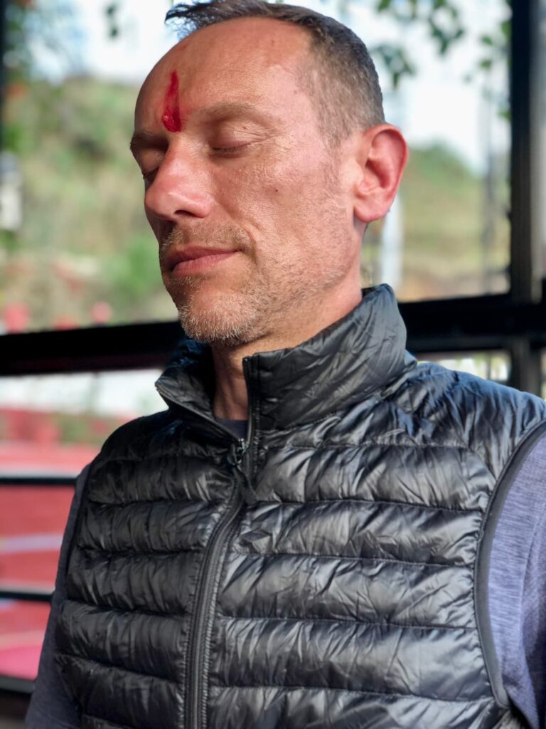 a man meditating in his home