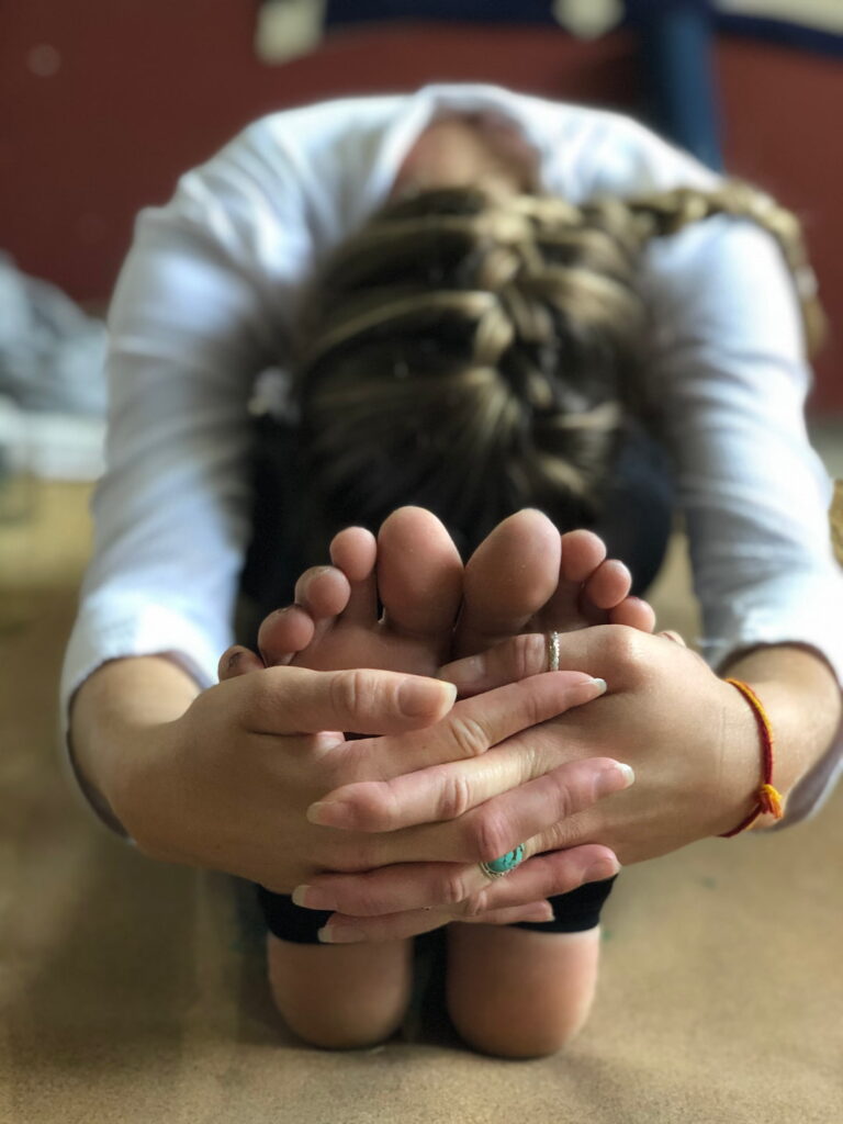 student doing hatha yoga asana class